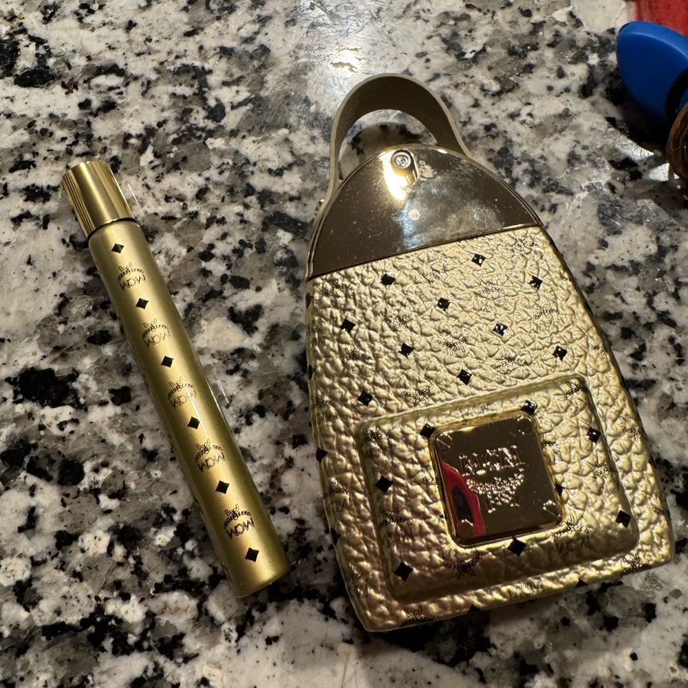 MCM Gold Perfume Bottle with Black Details